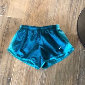 Green Nike running shorts
